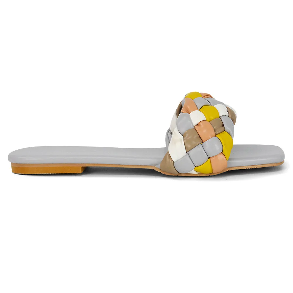 DARCIE WOVEN STRAP SQUARE TOE FLAT SLIDER SANDAL IN BLACK MULTI SYNTHETIC LEATHER