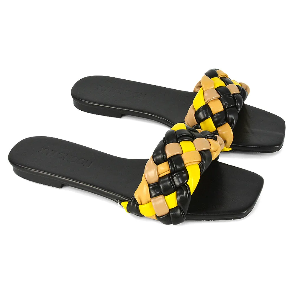 DARCIE WOVEN STRAP SQUARE TOE FLAT SLIDER SANDAL IN BLACK MULTI SYNTHETIC LEATHER